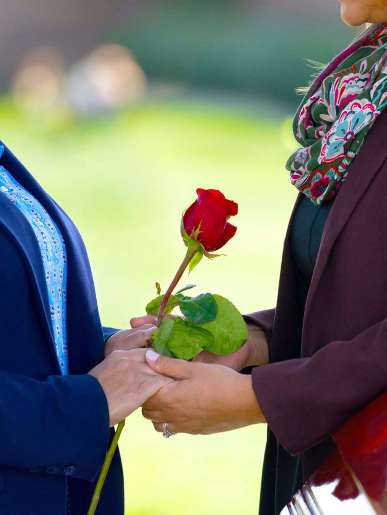 hand holding with rose